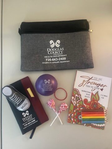 a quit-kit to he;lp people quick smoking which includes, candy, mints, a journal, a coloring book, and a few other things.